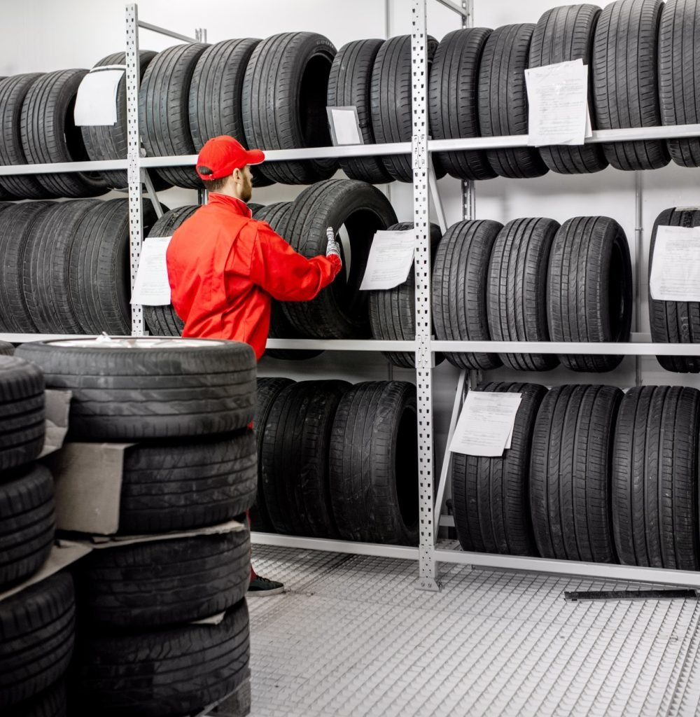 warehouse-with-car-tires-and-worker.jpg